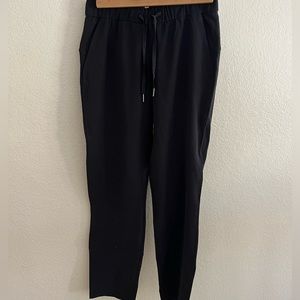 Lululemon tapered leg mid rise jogger/trouser. Black size 4. 7/8 front tie pant.